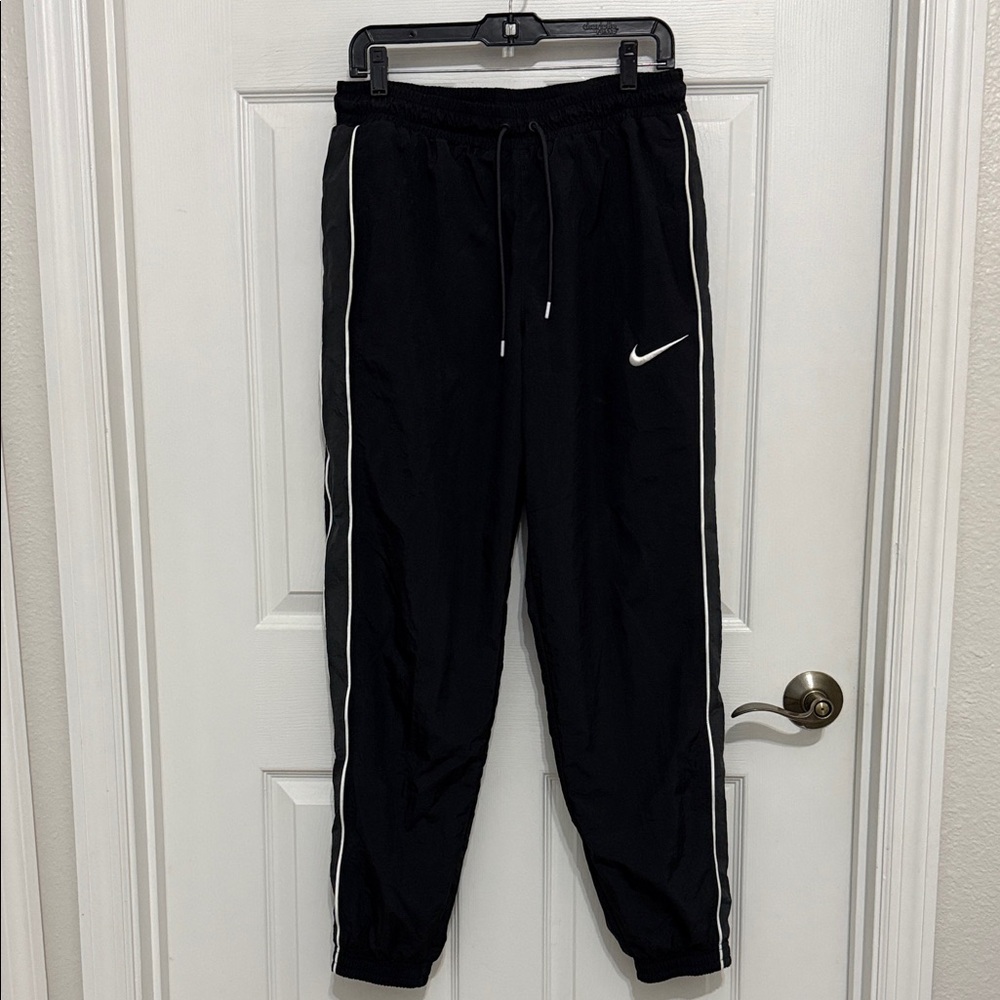 Nike men’s black Joggers with White Logo